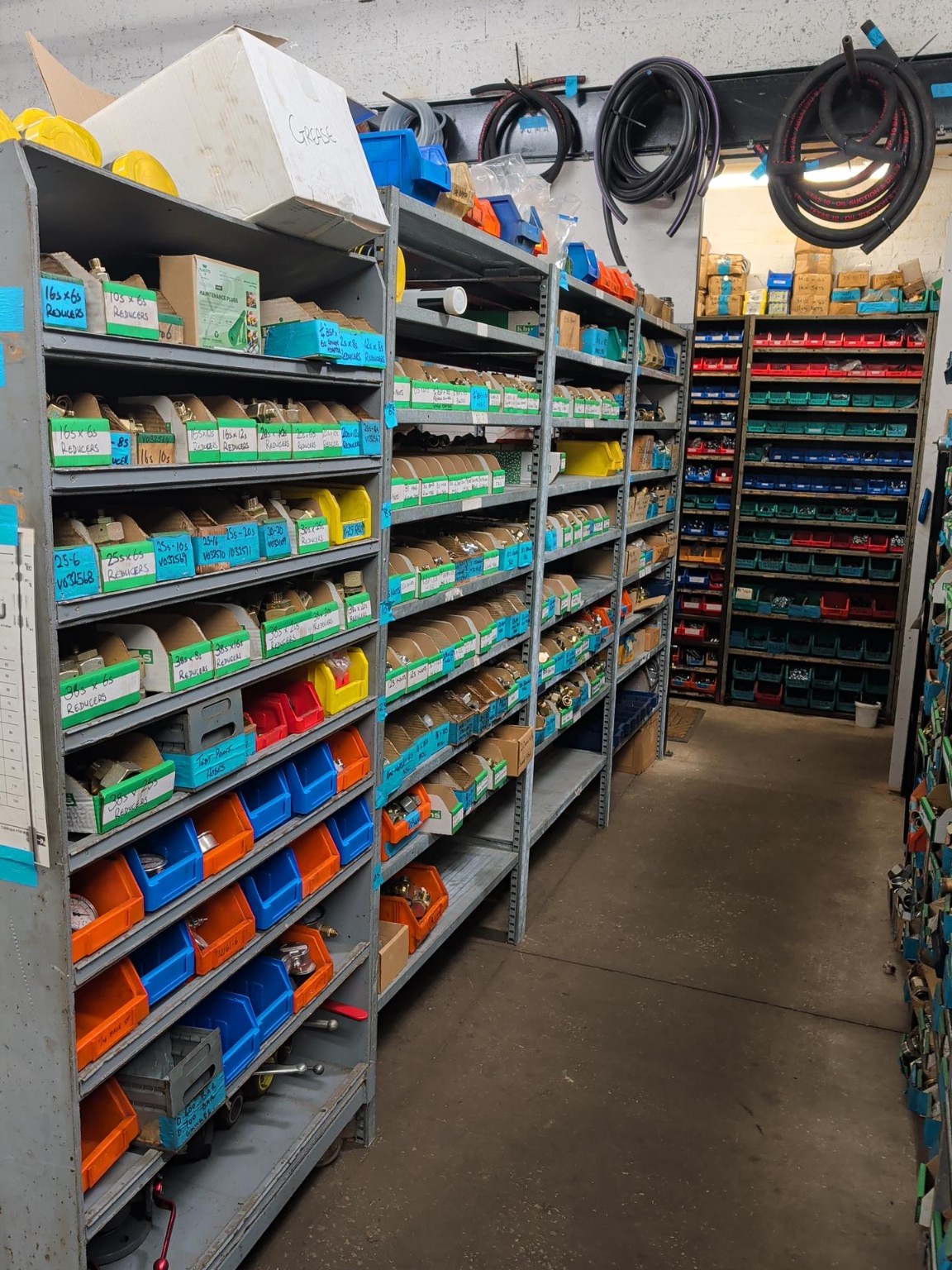 Reducers and hydraulic fittings stored in the Active Hydraulics workshop